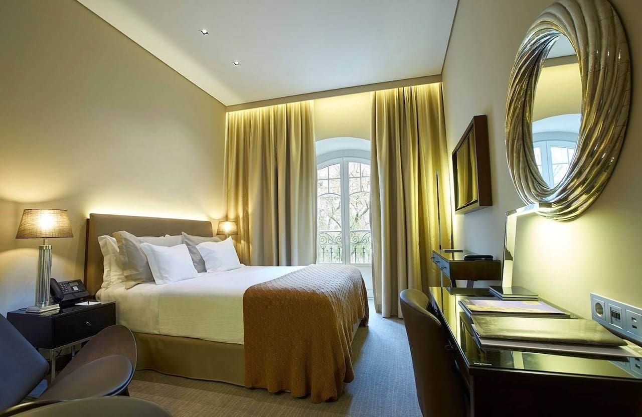 A classic room outfitted with a queen bed at PortoBay Liberdade in Lisbon.